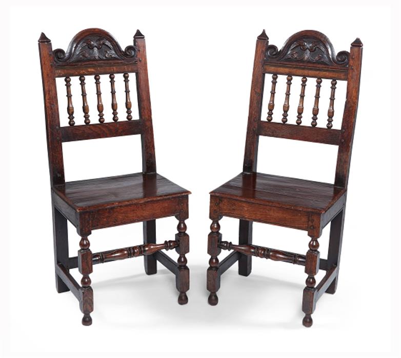 A pair of William and Mary oak solid-seat chairs, Lancashire
