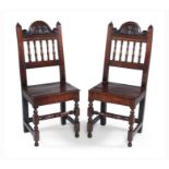 A pair of William and Mary oak solid-seat chairs, Lancashire