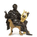 A late 19th century French patinated bronze and gilt bronze of a seated male Classical figure