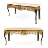 A pair of early 19th century Italian ebonised and parcel gilt carved neo-classical console tables