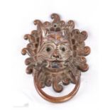 A Chinese bronze dragon mask door knocker, 16cm high.