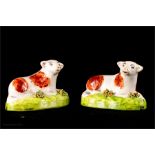 A pair of 19th century Staffordshire cows, 8cm long.
