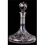 A cut glass decanter, with a compressed base, 28cm high.