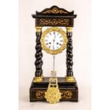 An ebonised marquetry mantle clock with gilt brass embellishments.