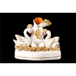 A 19th century Staffordshire spill holder, in the form of swans, circa 1875, 12cm high.