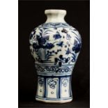 A blue & white Chinese vase, with heaped and piled paintwork, 22cm high.