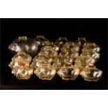 A collection of carnival glass pig form money box.