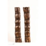 A pair of rosewood scroll weights, 3 by 4½ by 29cm.