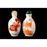 Two red and white porcelain Chinese scent/snuff bottles.