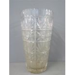 A large cut glass vase.