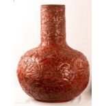 A large 19th century cinnabar style lacquer baluster vase, carved entirely with peonies, 57cm in