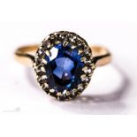 A 9ct gold ring, with blue paste oval stone to centre bordered by diamonds, size N, 2.5g.