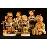 A group of eight Goebel Hummel figures.