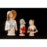 Three German porcelain doll tops.