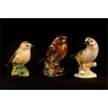 Two Beswick birds; Robin and Goldcrest, and a Kunstabeilung figure of a Tutter.