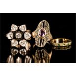 A group of four rings including an Art Deco ring with amethyst to the centre, and a further Art Deco