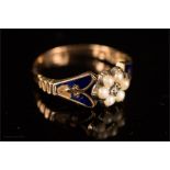 A 9ct gold enamel and seed pearl mourning ring.