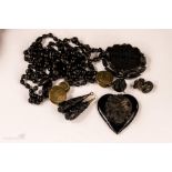 A group of Victorian jet to include a mourning brooch, heart form pendant, beaded necklace, pair