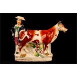 A Staffordshire cow creamer, circa 1850.