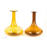 Two yellow glass decanters.