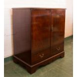 A mahogany TV cabinet.