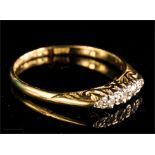 An 18ct gold and diamond ring, size P, 2.4g.