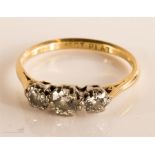 An 18ct gold and diamond ring, the three stones se