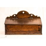 An 18th century oak candle box.
