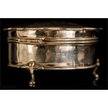 A silver trinket box, machine engraved, raised on