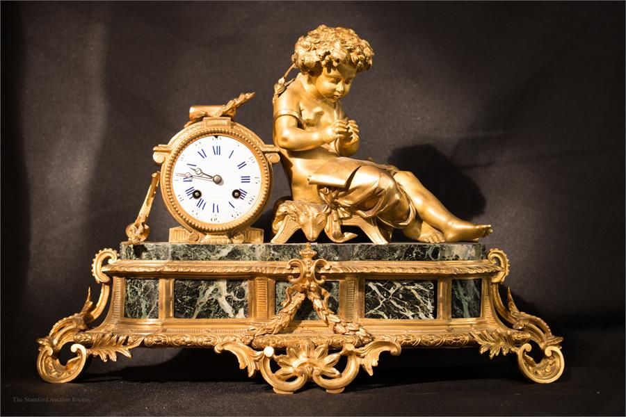 A French 19th century bronze ormolu and marble clo