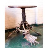 A rustic Blackforest style table with antler base.