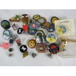 A group of vintage badges.