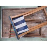 Two folding seats and a wooden wash board.