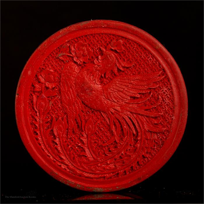 A Chinese lacquer box, carved with a peacock, 8cm