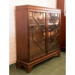 A mahogany book case with astrigal glazed doors.