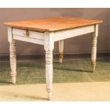 A rustic pine kitchen table with painted base.