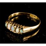 An 18ct gold and opal ring, size P, 1.9g, with pre