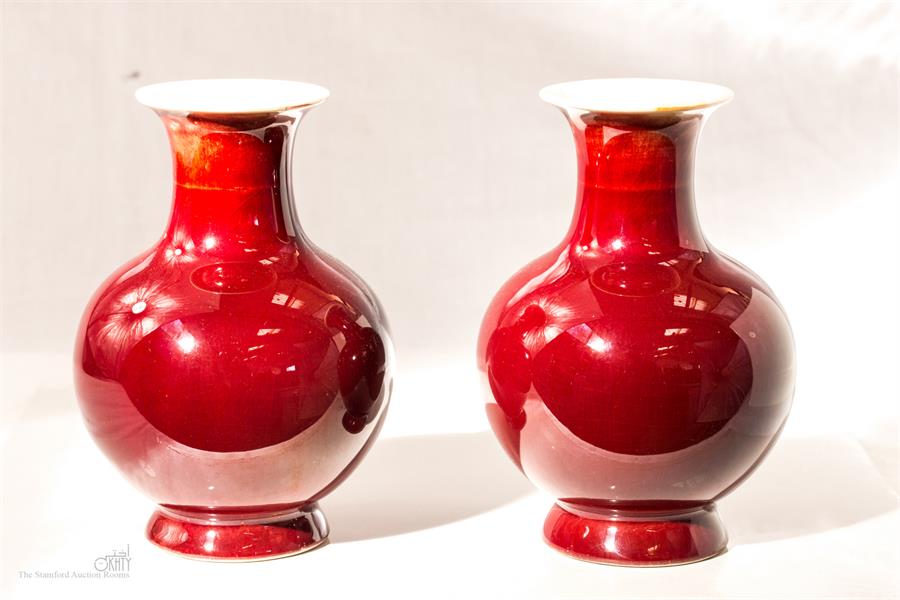 A pair of Sangue de Boeuf Chinese vases, 14cm high