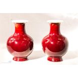 A pair of Sangue de Boeuf Chinese vases, 14cm high