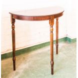 A demi lune mahogany hall table.