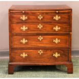 An 18th century mahogany bachelors chest, the brush slide above four graduated drawers, raised on