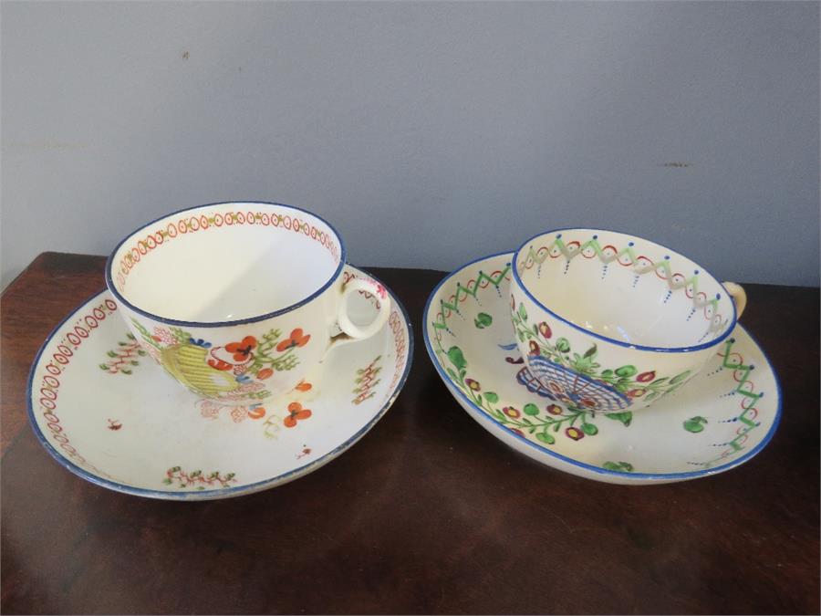 Two early pottery hand painted cups and saucers. - Bild 2 aus 2