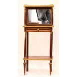 A French 19th century mahogany and ormolu mirrored back bijouterie stand. 115 by 49 by 30½cm