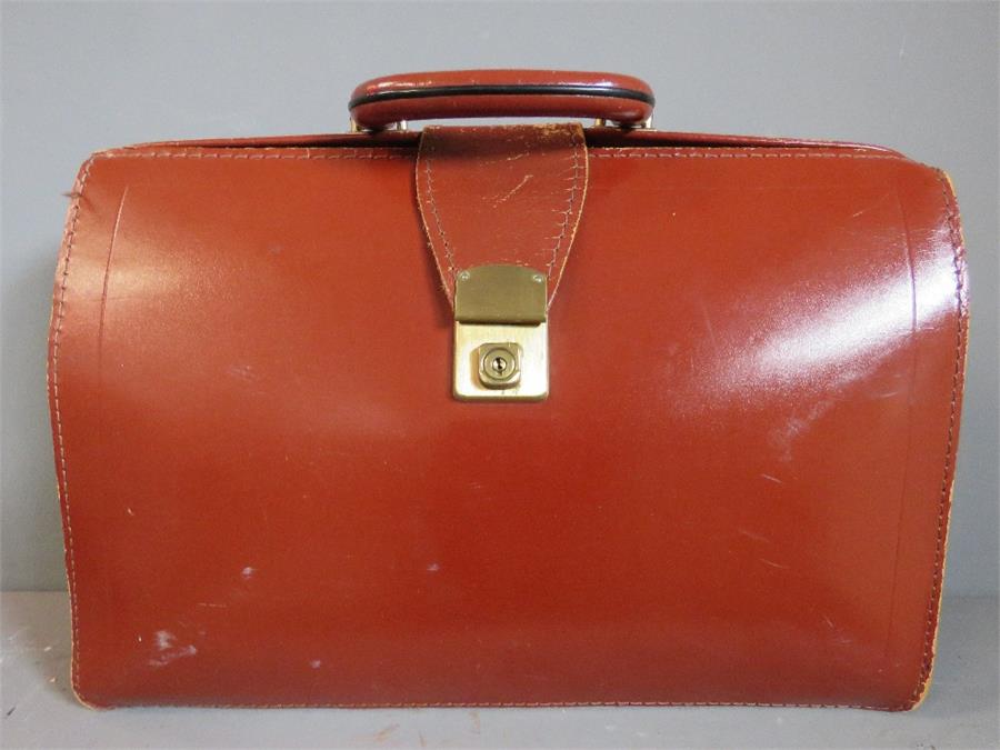 A tan leather bag.