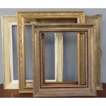 A group of four picture frames, of various style.