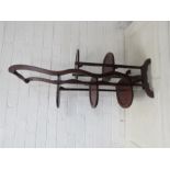 A mahogany cake stand.