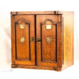 An oak cigar cabinet with secure Lever, fitted int