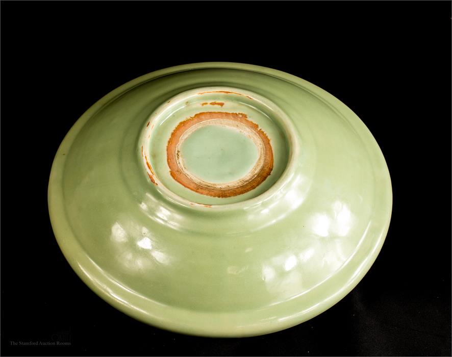 A Ming Dynasty large celadon dish. - Image 2 of 2