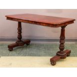 A mahogany table, in the manner of Gillows, with lobe carved end suppors, beaded edges and raised on