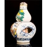 A Chinese erotic bottle, 8cm high.